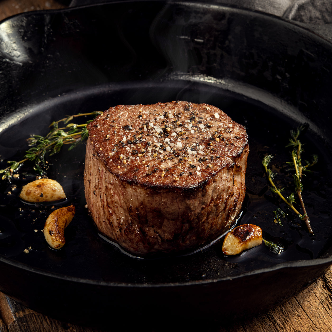 cooked USDA Prime Filet Mignon steak on skillet 