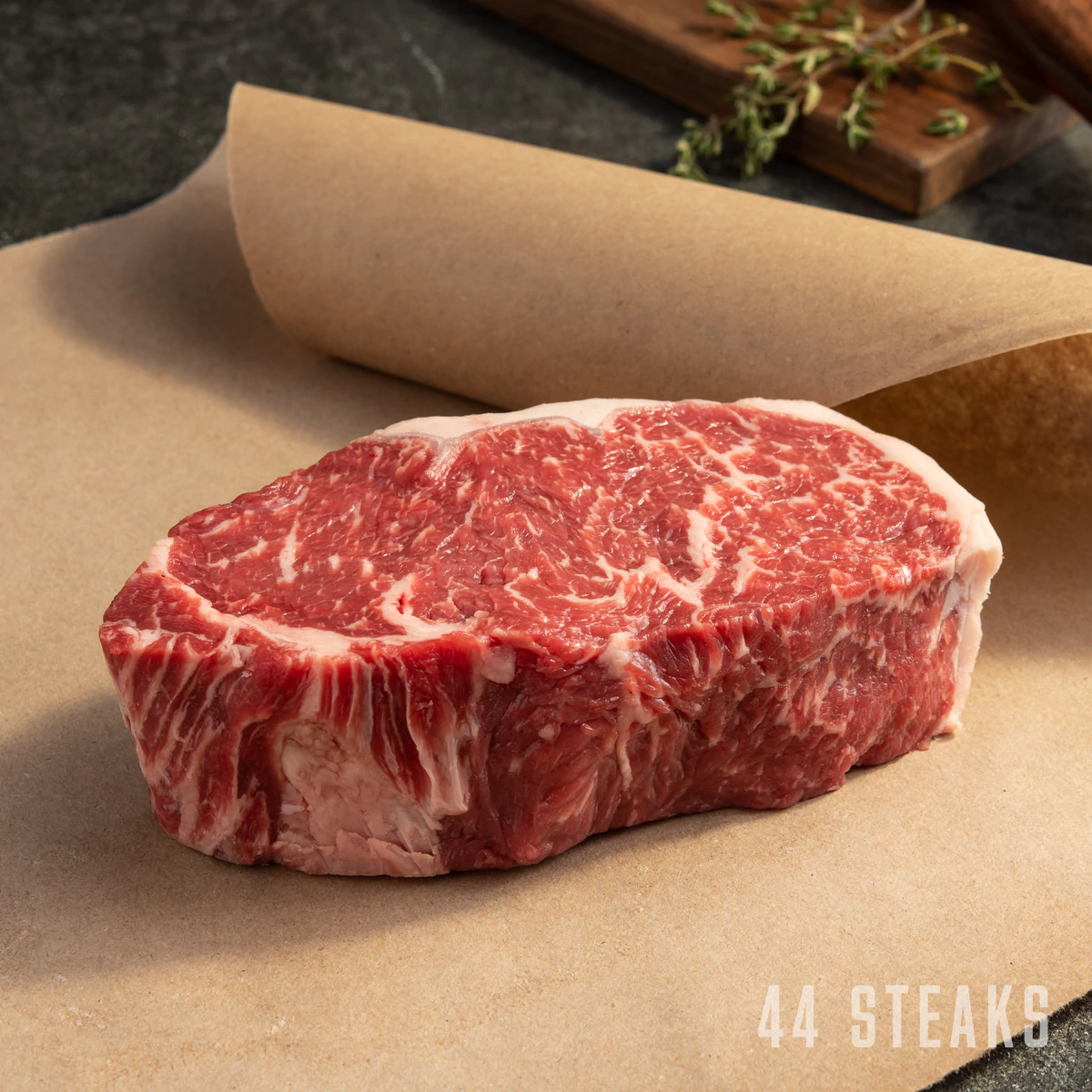 usda prime new york strip steak on parchment paper